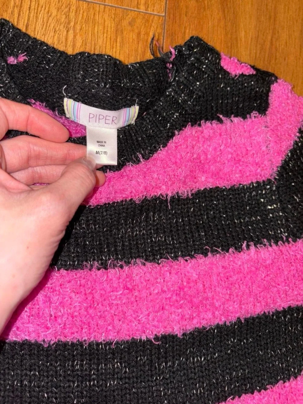 black and pink striped sweater